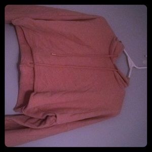 A pink cropped hoodie